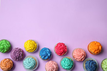 Different Cupcakes On Color Background
