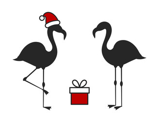 Wall Mural - Two Christmas flamingo birds, Santa hat and present.