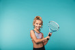 Cheerful young sports girl playing tennis