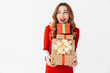 © Drobot Dean - Beautiful emotional woman in christmas costume holding present gift box.