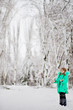 © Svetlana - Funny little girl having fun in beautiful park during snowfall