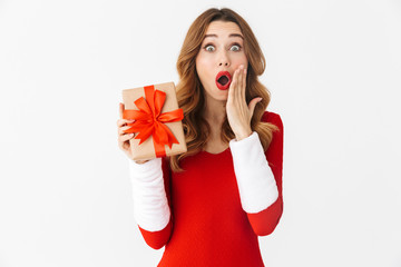 Wall Mural - Beautiful shocked emotional woman in christmas costume holding present gift box.