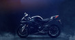 Black modern sports motorcycle on dark background with smoke (3D illustration)