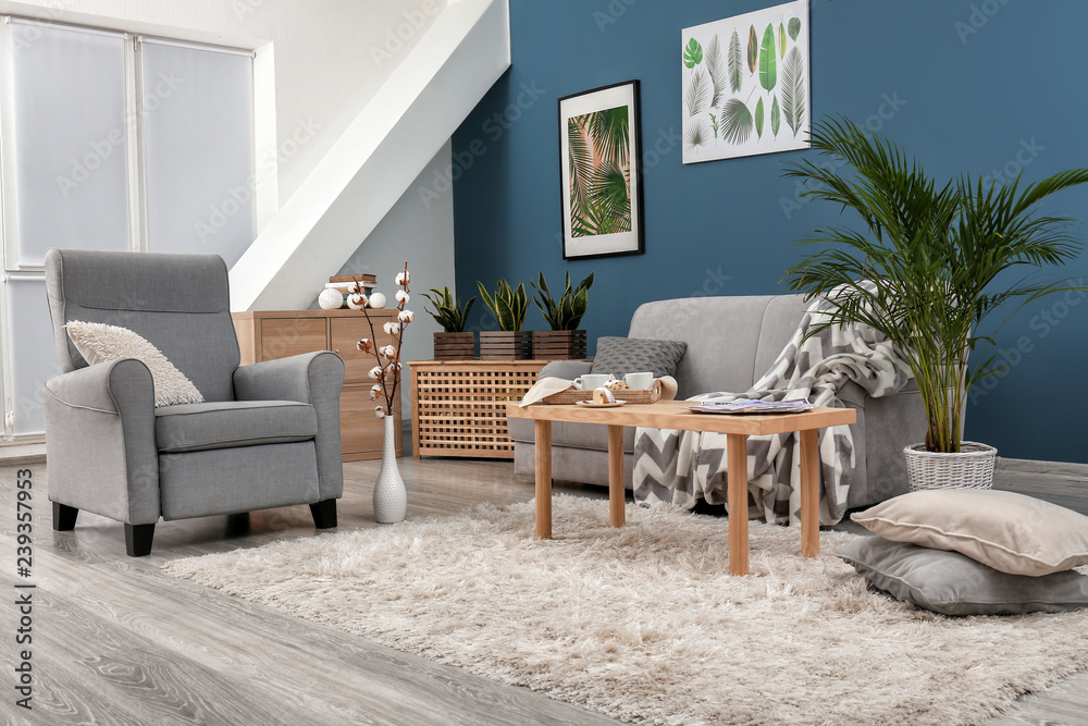 Stylish interior of room with comfortable armchair