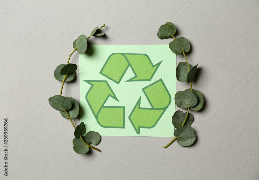 Recycling symbol on light background
