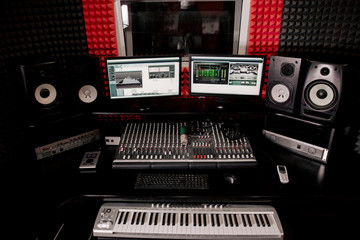 DJ Studio equipment. Mixing console on the table. Empty recording Studio room