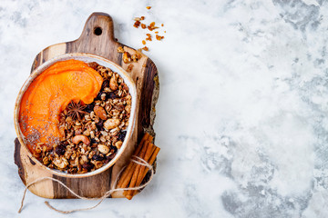 Poster - Fall breakfast bowl with cinnamon granola, coconut yogurt, chia seeds and pumpkin puree. Healthy vegan, vegetarian autumn smoothie bowl