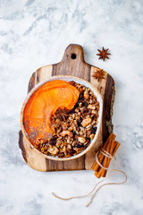 Poster - Fall breakfast bowl with cinnamon granola, coconut yogurt, chia seeds and pumpkin puree. Healthy vegan, vegetarian autumn smoothie bowl