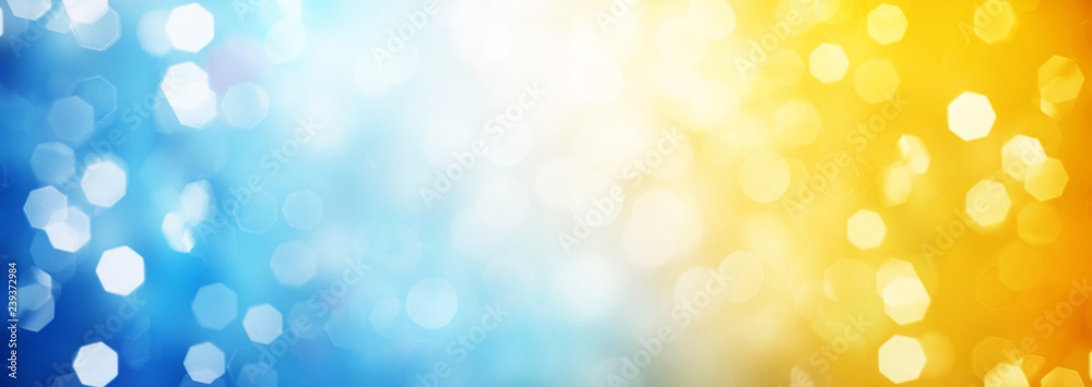 Blue and yellow circular reflections. Blured Christmas and New Year light. Winter abstract defocused background. - obrazy, fototapety, plakaty 