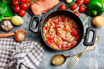 Wall Mural - Goulash soup, salmon fillet and colorful vegetables