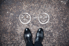 Shoes With Smile On Asphalt