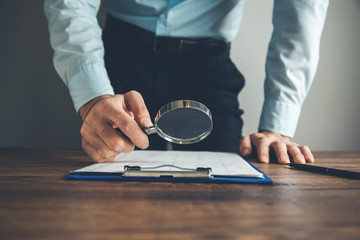 Wall Mural - hand magnifier with document