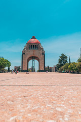 Wall Mural - Mexico city/ May, 29, 2018: Long shot of a famous landmark in the street on blue sky