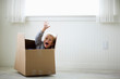 © Erickson Stock - Portrait of a young boy in a box.