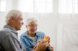 © Erickson Stock - Senior couple looking at a medicine bottle.