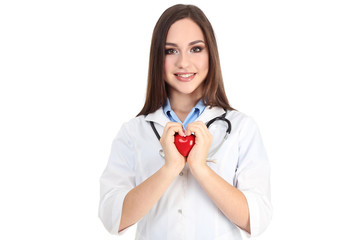 Wall Mural - Portrait of young doctor with stethoscope and red heart on white background