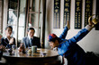 © Erickson Stock - Young adult man dressed in traditional clothing doing a tea ritual in a cafe.