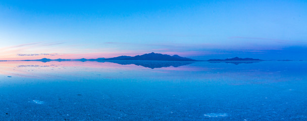 Uyuni reflections. One of the most amazing things that a photographer can see. Here we can see how the sunrise over an infinite horizon with the Uyuni salt flats making a wonderful mirror to infinity