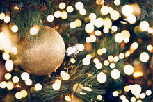 Seasonal Background With Christmas Toy On The Tree. Celebration Concept. Soft Focus. Festive Bold Bokeh