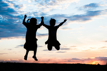 Wall Mural - Silhouette of children playing