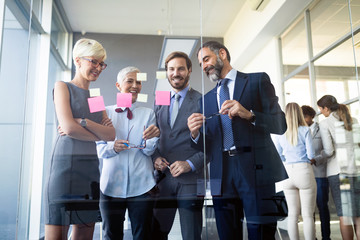 Successful team leader and business owner leading informal in-house business meeting