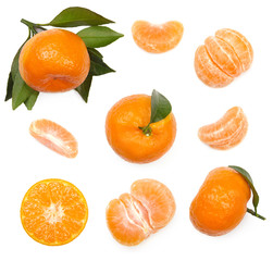 Wall Mural - A set of tangerines with leaves and slices of mandarin, cut out. Top view.