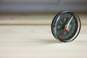 compass on the table .