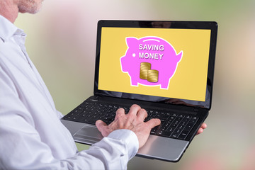 Poster - Money saving concept on a laptop