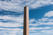 Detail Of Tall Brick Chimney Extending Towards Cloudy Sky 
