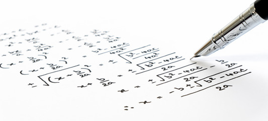 handwriting of mathematics quadratic equation formula on examination, practice, quiz or test in math