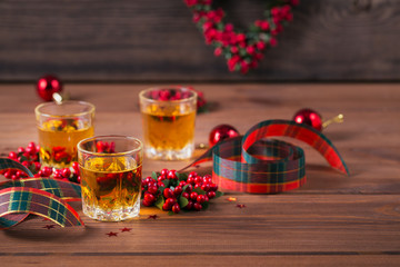 Whiskey, brandy or liquor shot and Christmas decorations