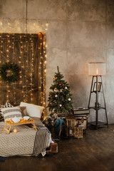 Wall Mural - Christmas interior of a cozy bedroom with a Christmas tree and gifts