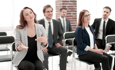 male and female colleagues discussing document at team meeting o