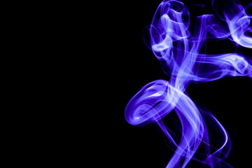 Blue smoke on black background