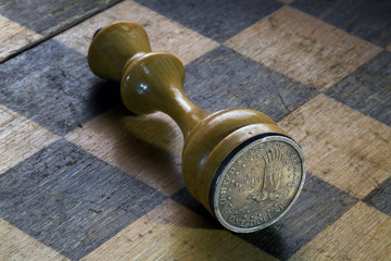 Chess King with a 1 Dollar Coin on a Chess Board