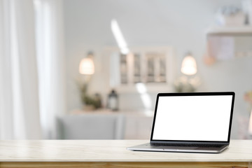 Fototapete - Mockup blank screen tablet with smart keyboard on table over living room background
