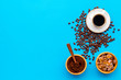 coffee bean and cup of americano on blue table background top view mockup