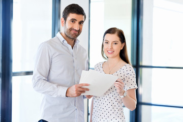 Poster - Image of two young business people in office