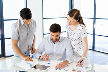 Wall Mural - Group of happy young business people in a meeting