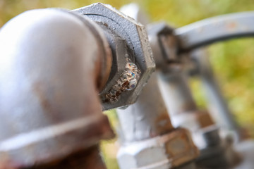 Gas pipe with soap mixture showing bubbles from gas leak