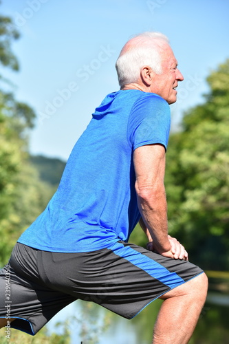 Fotografie, Obraz Athletic Male Senior Stretching Outdoors