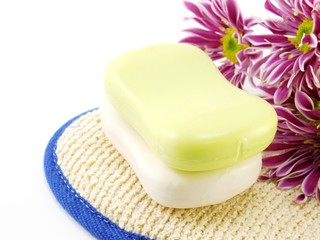 soap bar on white bath towel and scrub