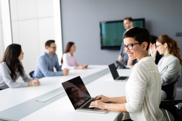 Group of lawyers discussing contract together in office