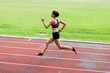 © Westend61 - Teenage runner training on race track