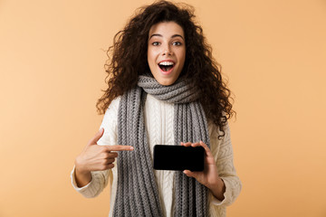 Sticker - Cheerful young woman wearing winter scarf