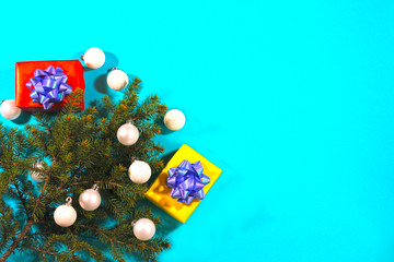 Gift boxes, Christmas tree and decorations on a blue background. Christmas concept.