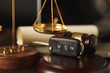 © burdun - Close up of judge gavel and car keys over soundboard