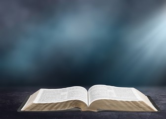Wall Mural - open book on old wooden table.