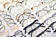 Glasses, Eyeglasses Optical Store, Fashion eyewear at night market, Colorful glasses, Glasses on shelf, Glasses in optical store shopping mall (Selective Focus)