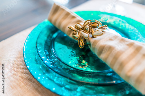 Fotografie, Obraz Macro closeup of decorated table plate setting with blue colors and vibrant napk